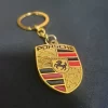 ff2f6cc7-7c8d-4a76-b8ce-4d3822dbd9e0 copy Car keychain Double Faced logo for Porsche Gold